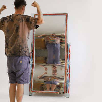Lot 85 - A fairground distortion mirror