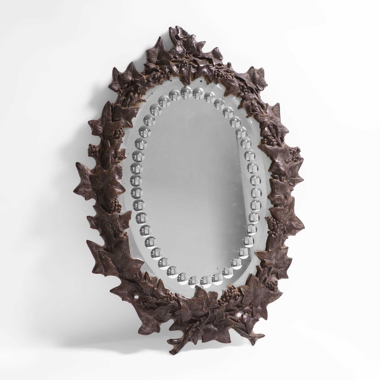 Lot 15 - An oval sorcerer's mirror