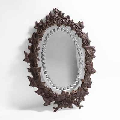 Lot 15 - An oval sorcerer's mirror