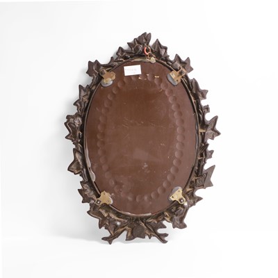 Lot 15 - An oval sorcerer's mirror