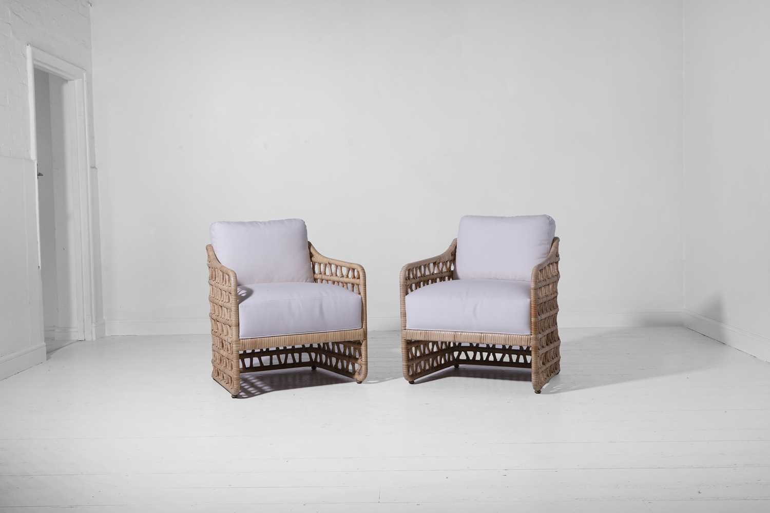 Lot 569 - A pair of rattan 'Thea' lounge chairs by Paolo Moschino