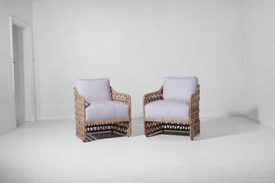 Lot 569 - A pair of rattan 'Thea' lounge chairs by Paolo Moschino