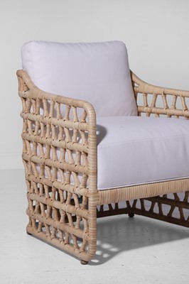 Lot 569 - A pair of rattan 'Thea' lounge chairs by Paolo Moschino