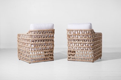 Lot 569 - A pair of rattan 'Thea' lounge chairs by Paolo Moschino