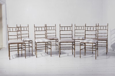 Lot 543 - A set of eight gilt-metal faux bamboo dining chairs
