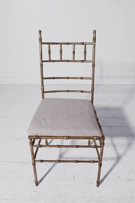 Lot 543 - A set of eight gilt-metal faux bamboo dining chairs