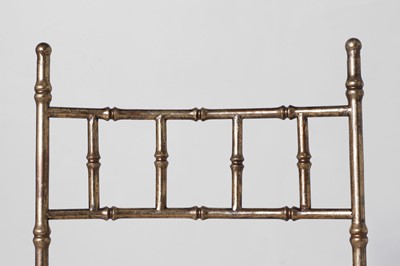 Lot 543 - A set of eight gilt-metal faux bamboo dining chairs