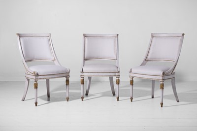 Lot 547 - A set of three Empire-style painted and parcel-gilt wooden tub chairs