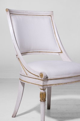 Lot 547 - A set of three Empire-style painted and parcel-gilt wooden tub chairs