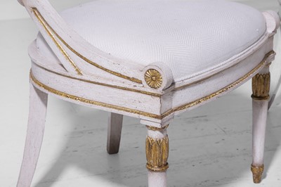 Lot 547 - A set of three Empire-style painted and parcel-gilt wooden tub chairs