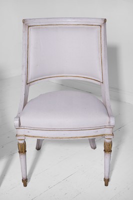 Lot 547 - A set of three Empire-style painted and parcel-gilt wooden tub chairs