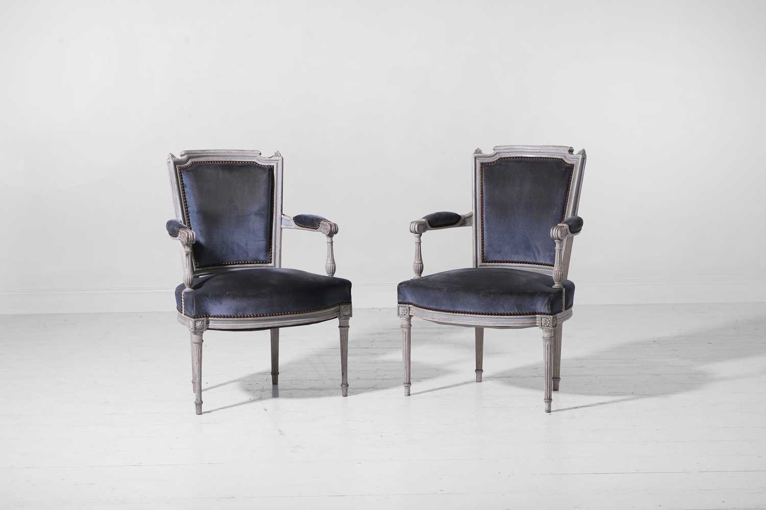 Lot 555 - A pair of Louis XVI-style painted wooden fauteuils