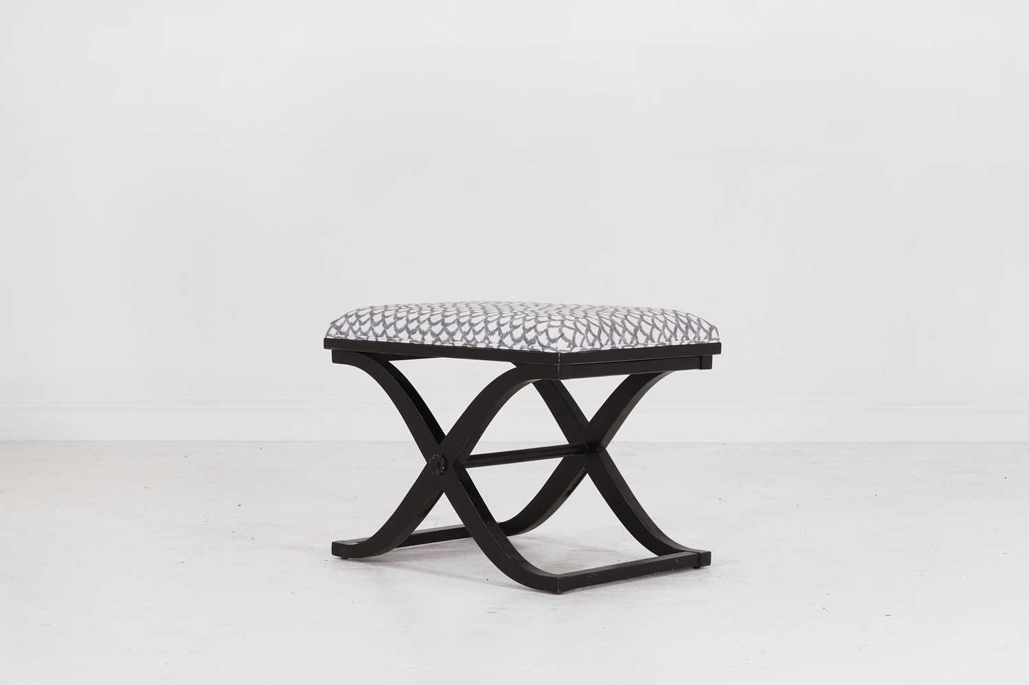 Lot 557 - An ebonised wooden stool by Paolo Moschino