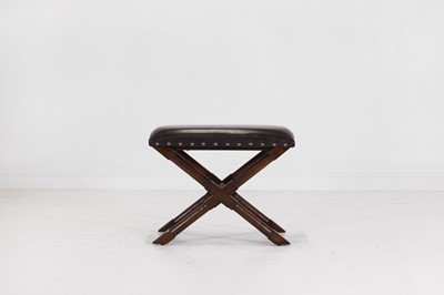 Lot 536 - A leather and stained wooden 'X' frame stool