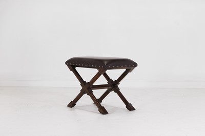 Lot 536 - A leather and stained wooden 'X' frame stool