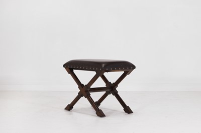 Lot 536 - A leather and stained wooden 'X' frame stool
