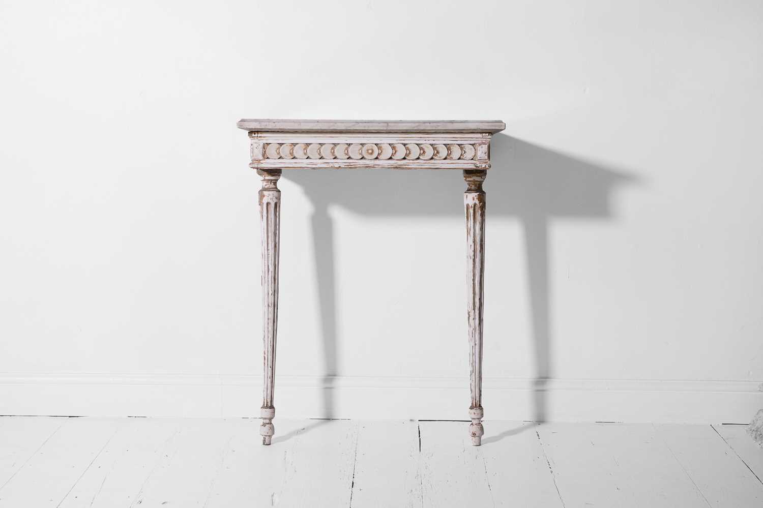 Lot 358 - A Louis XVI-style painted and parcel-gilt wooden pier table
