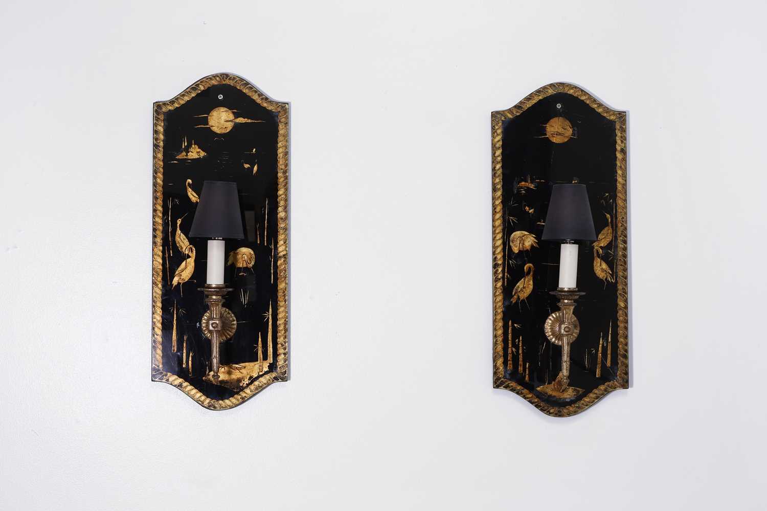 Lot 329 - A pair of verre églomisé wall sconces