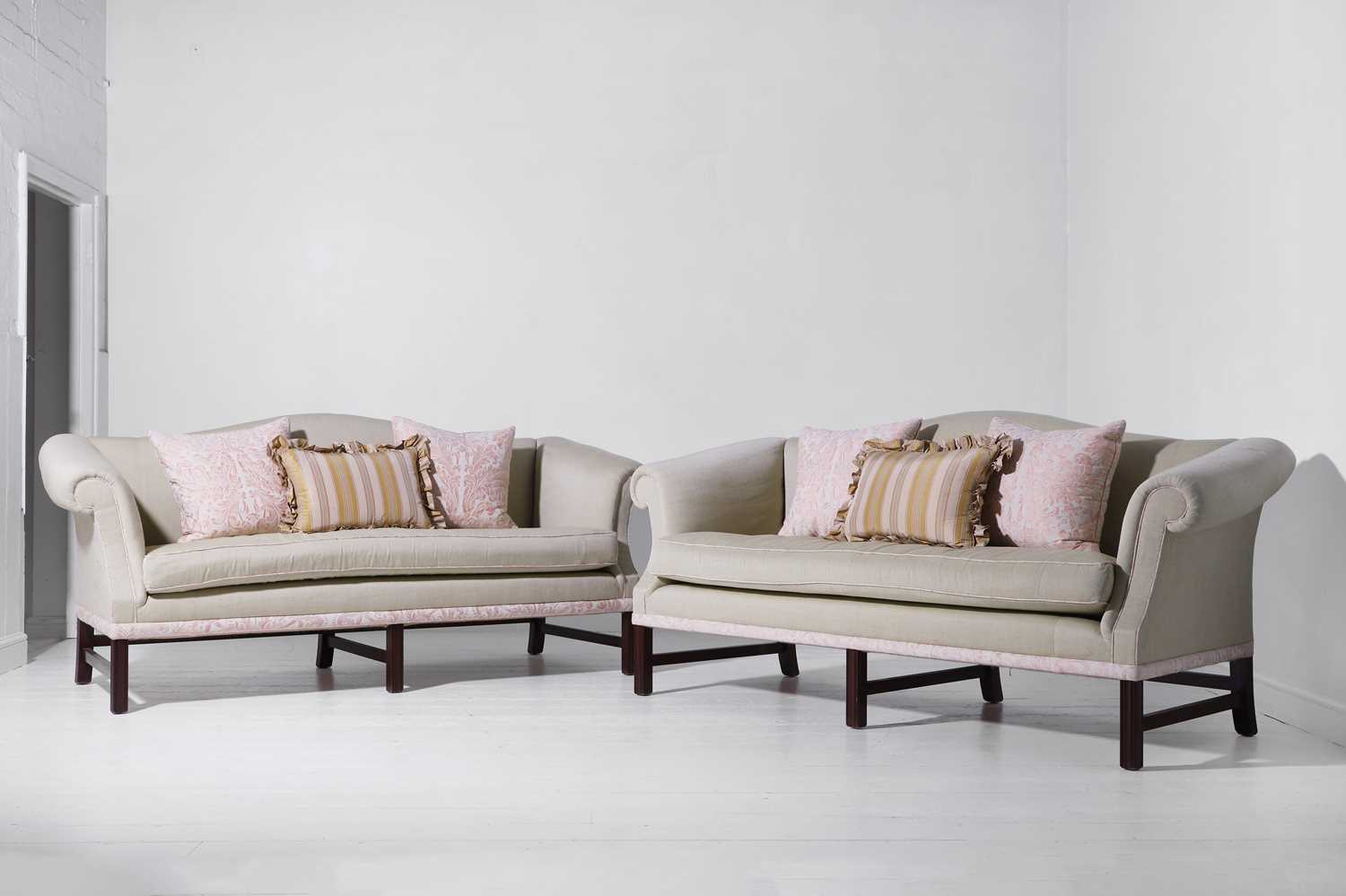 Lot 322 - A pair of ‘Chippendale’ sofas by Peter Dudgeon