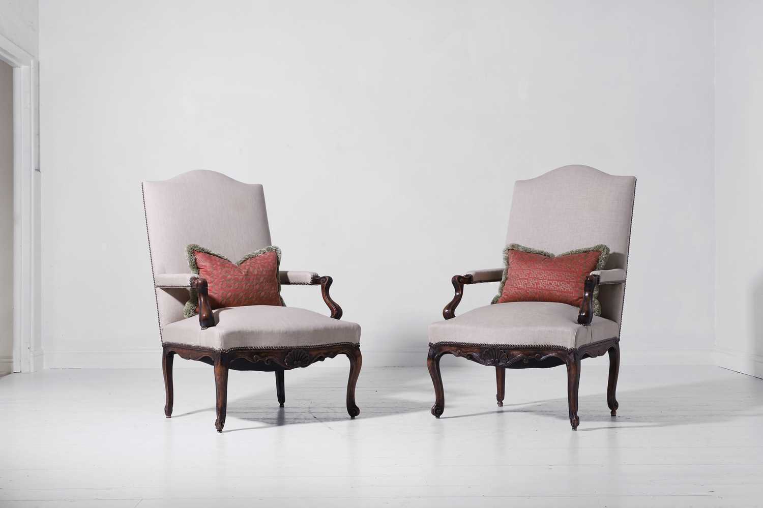 Lot A pair of Louis XV provincial walnut and beech fauteuils