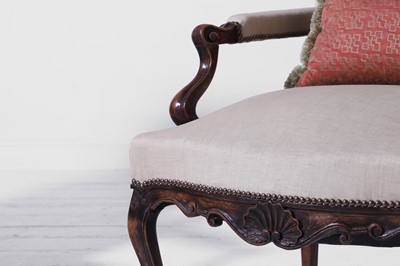 Lot A pair of Louis XV provincial walnut and beech fauteuils