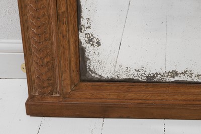 Lot 320 - A Louis XVI-style carved oak pier mirror