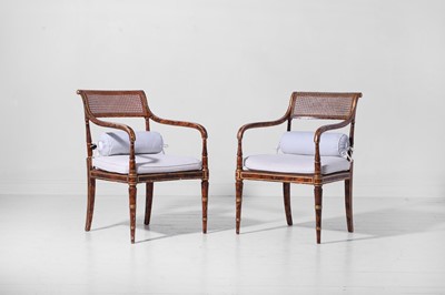 Lot 340 - A pair of Regency-style painted and parcel-gilt beech elbow chairs