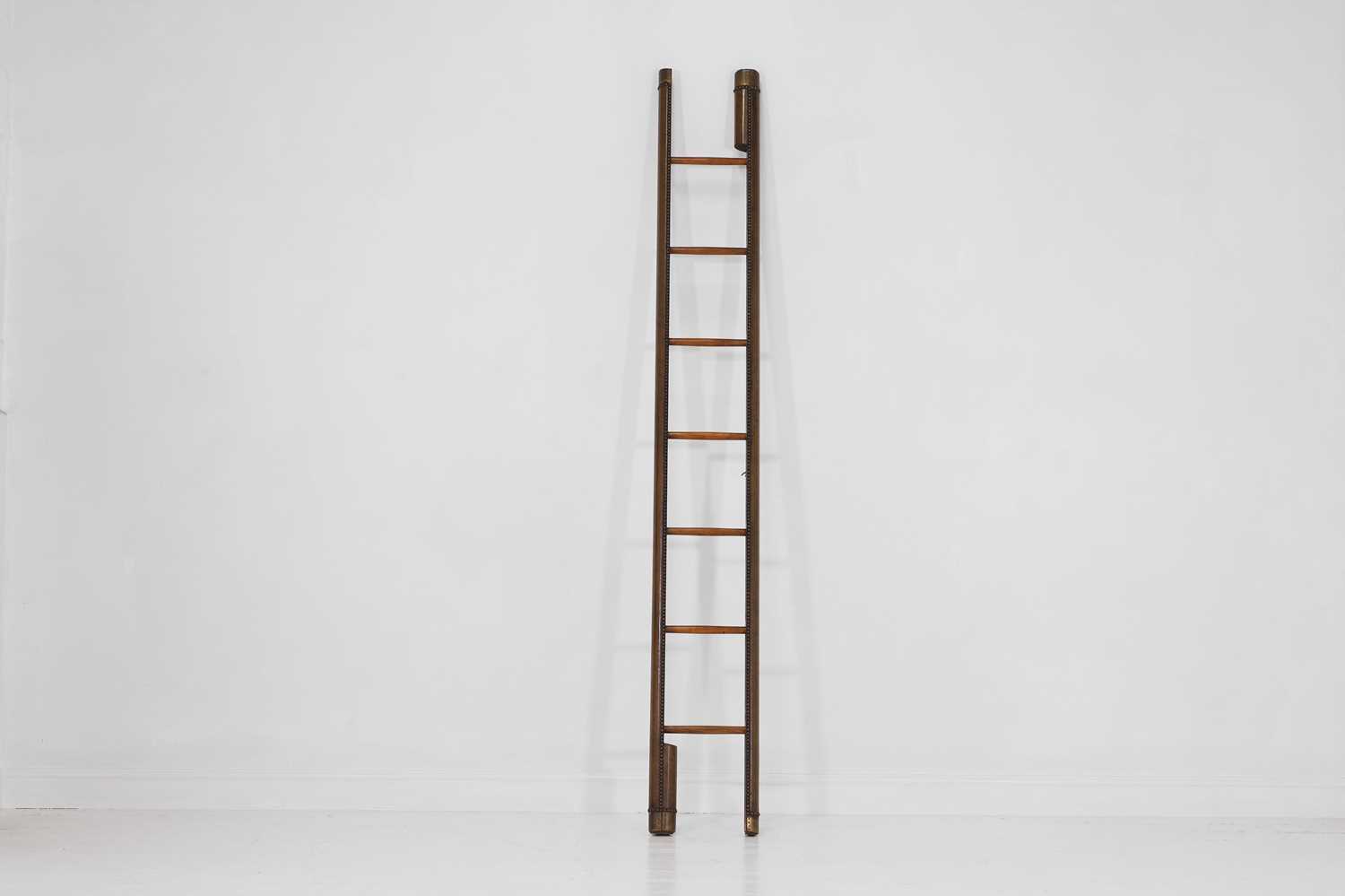 Lot 346 - A folding studded-leather library ladder