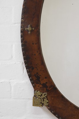 Lot 339 - A leather and brass oval mirror