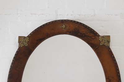 Lot 339 - A leather and brass oval mirror