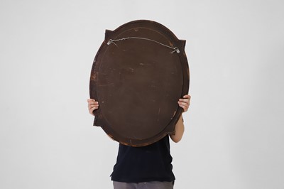 Lot 339 - A leather and brass oval mirror