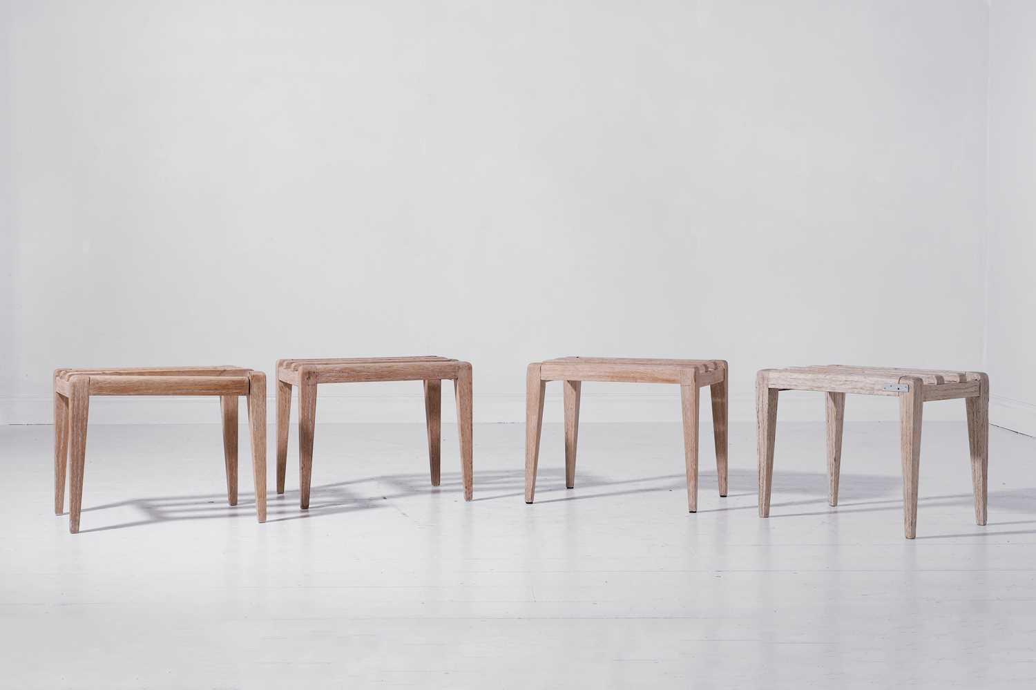 Lot 353 - A set of four bleached oak luggage racks by Thonet