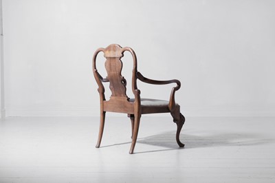 Lot 342 - A large George II-style figured walnut and beech open armchair