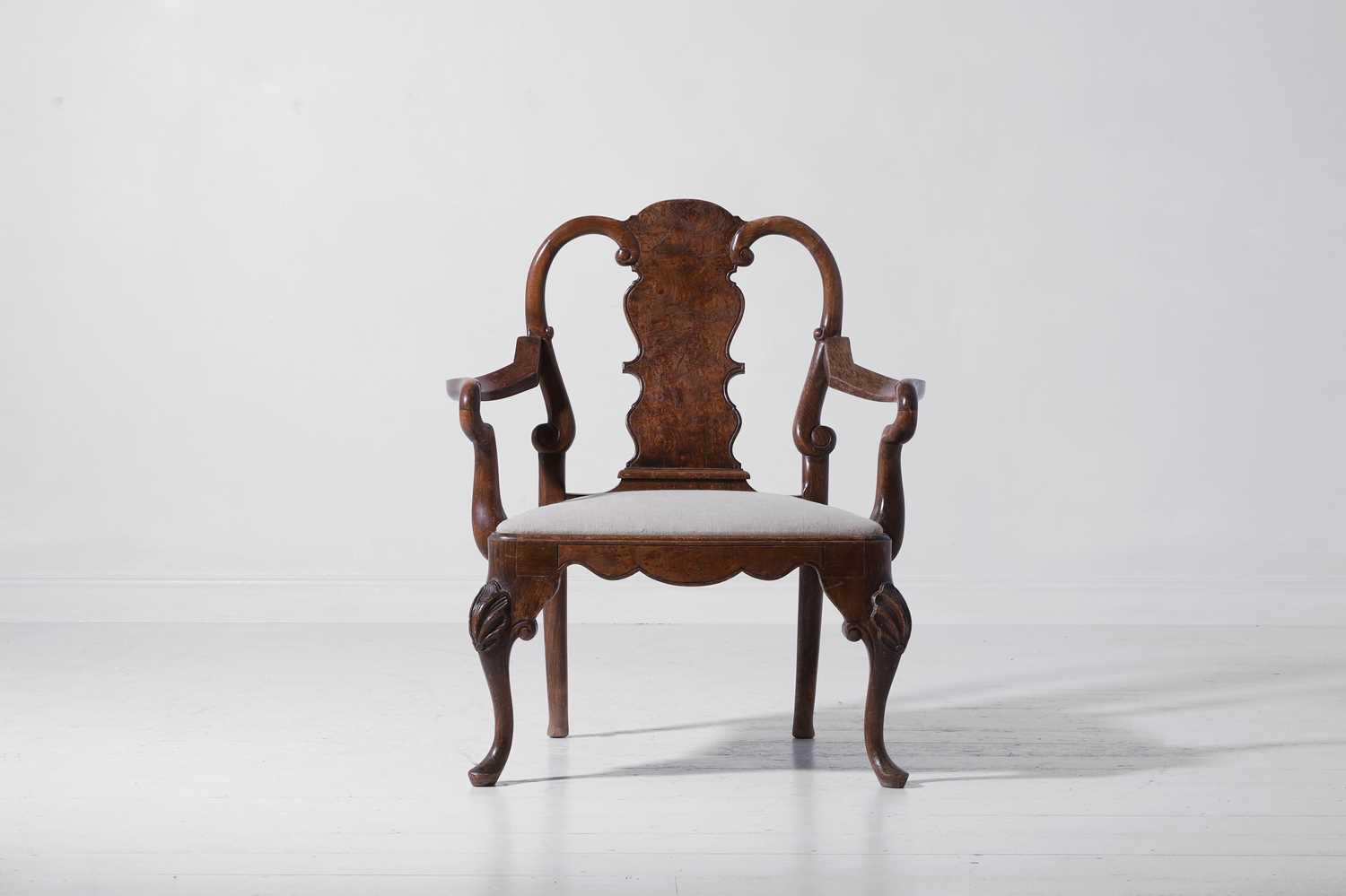 Lot 342 - A large George II-style figured walnut and beech open armchair