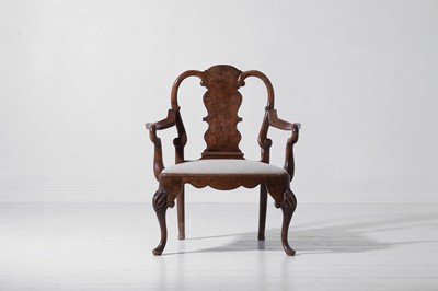 Lot 342 - A large George II-style figured walnut and beech open armchair