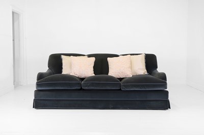Lot 333 - A three-seater sofa in the style of Howard & Sons