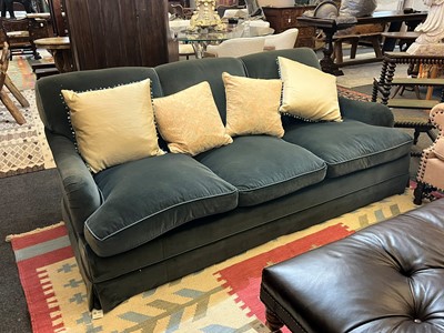 Lot 333 - A three-seater sofa in the style of Howard & Sons