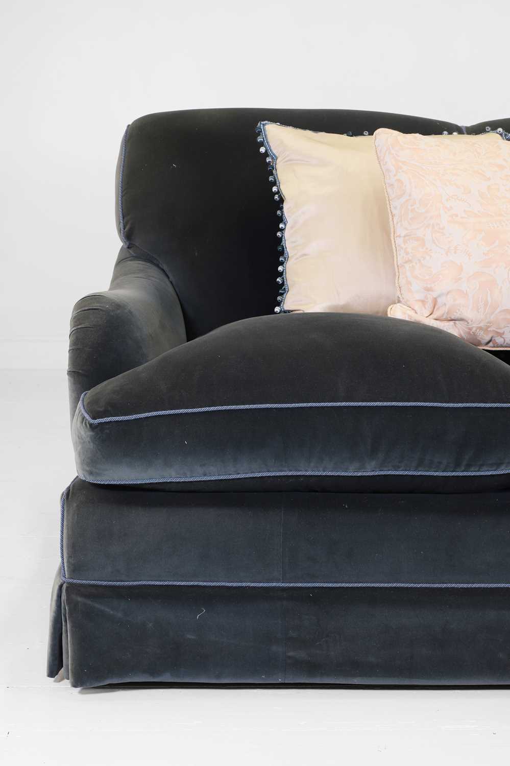 Lot 333 - A three-seater sofa in the style of Howard & Sons