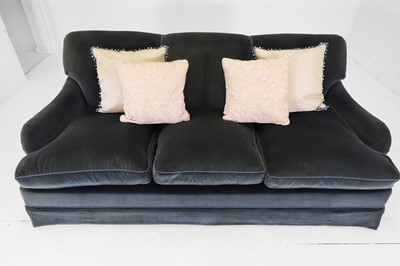 Lot 333 - A three-seater sofa in the style of Howard & Sons