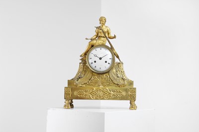 Lot 199 - An Empire period ormolu mantel clock