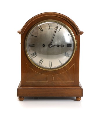 Lot 211 - An Edwardian inlaid mahogany mantle clock