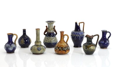 Lot 142 - A collection of miniature pottery Doulton Lambeth jugs and vases