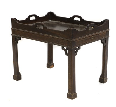 Lot 437 - A mahogany tray top table