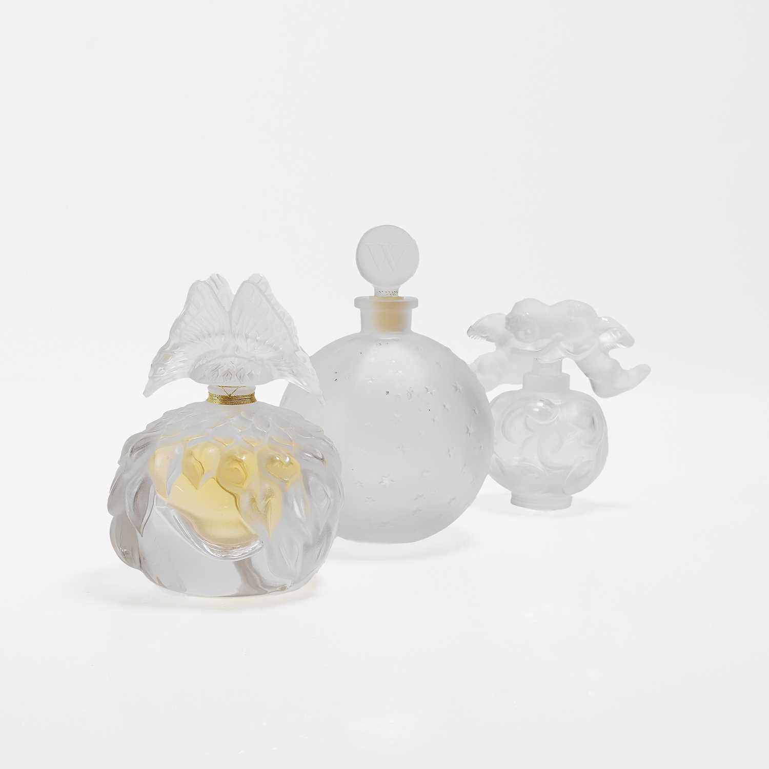 Lot 134 - A group of three Lalique glass scent bottles