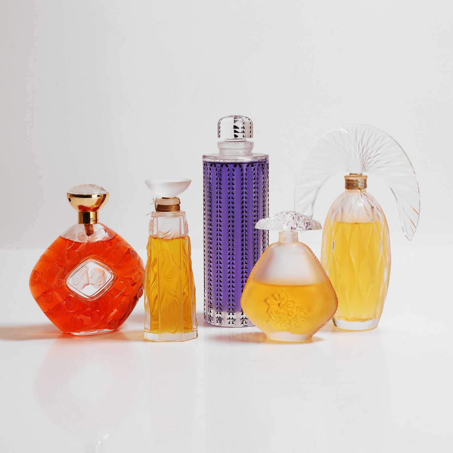 Lot 136 - A group of Lalique glass scent bottles