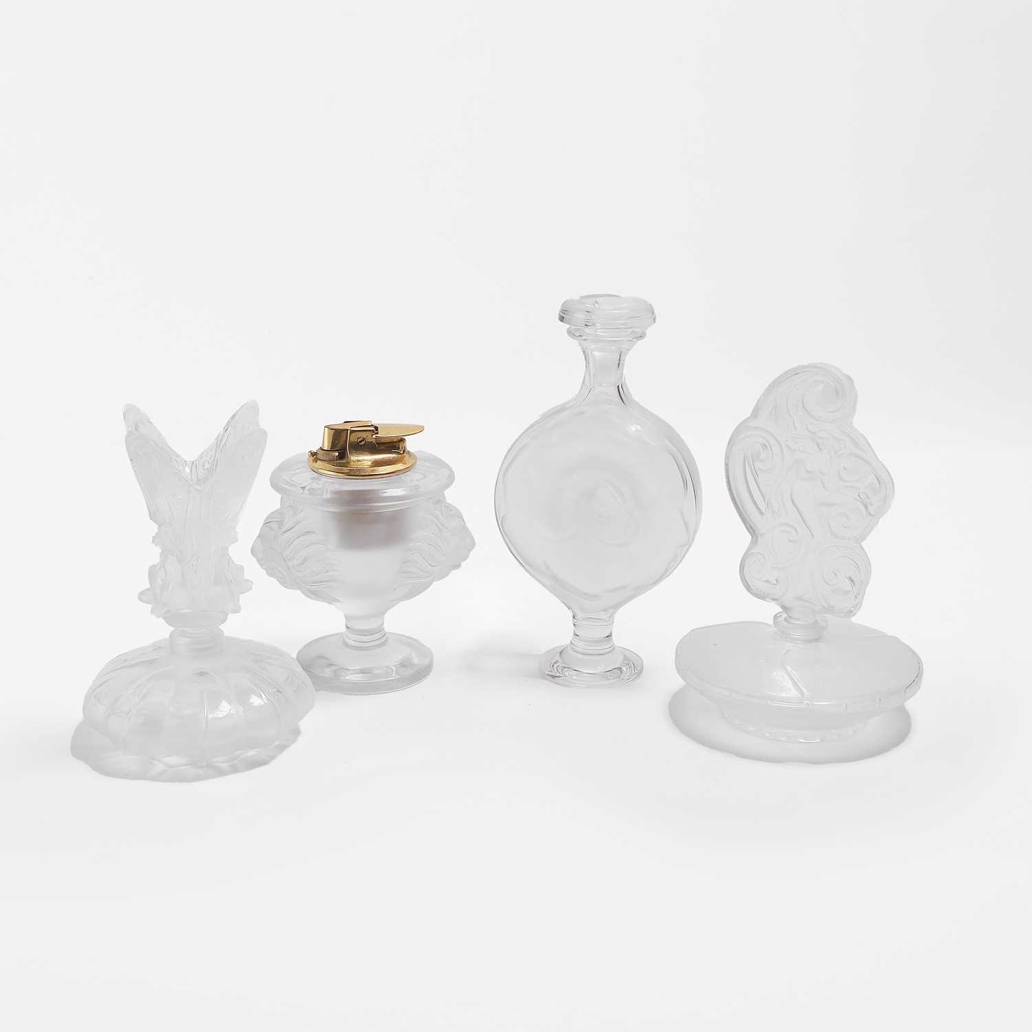 Lot 130 - A group of three Lalique glass scent bottles