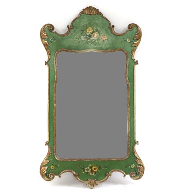 Lot 435 - A gilt and green-painted mirror