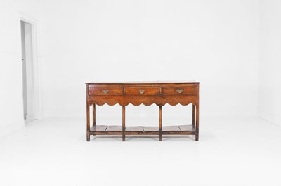 Lot 490 - A small George III oak dresser base