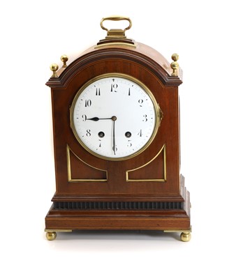Lot 215 - An Edwardian mahogany and brass mounted mantle clock