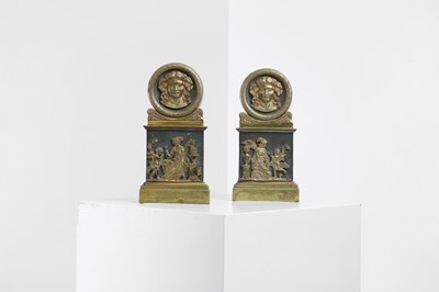 Lot 170 - A pair of Empire painted and gilt-brass chenet mounts